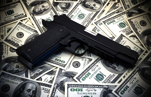 Black And Chrome Gun Pistol And Money Dollars Background Stock Photo ...