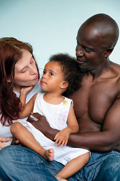 black and white mixed family. - black women kissing white men stock picture...