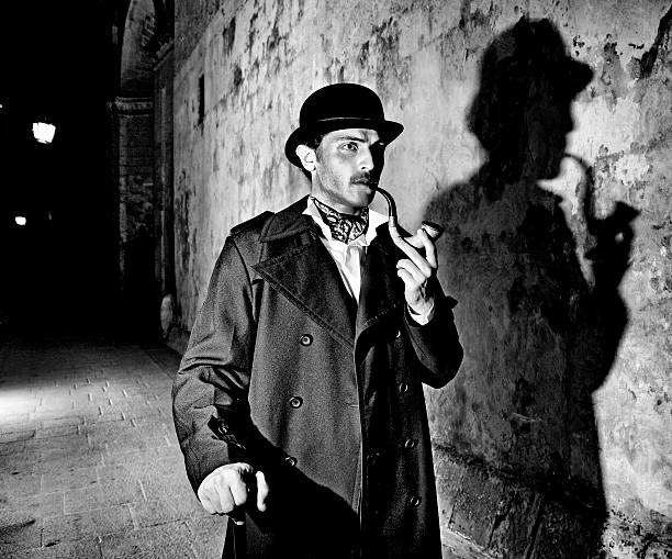 Black and white picture of a detective smoking his pipe Man dressed up as famous detective Sherlock Holmes outdoors, including typical shadow

Note: All props in this shoot including pipe are authentic vintage items. Slight light trails and motion blur on arms. Black and White. Grain Added.

[url=file_closeup.php?id=13571687][img]file_thumbview_approve.php?size=1&amp;id=13571687[/img][/url] [url=file_closeup.php?id=13548314][img]file_thumbview_approve.php?size=1&amp;id=13548314[/img][/url] [url=file_closeup.php?id=13548292][img]file_thumbview_approve.php?size=1&amp;id=13548292[/img][/url] [url=file_closeup.php?id=13548271][img]file_thumbview_approve.php?size=1&amp;id=13548271[/img][/url] [url=file_closeup.php?id=13548249][img]file_thumbview_approve.php?size=1&amp;id=13548249[/img][/url] [url=file_closeup.php?id=13548231][img]file_thumbview_approve.php?size=1&amp;id=13548231[/img][/url] [url=file_closeup.php?id=13894179][img]file_thumbview_approve.php?size=1&amp;id=13894179[/img][/url] [url=file_closeup.php?id=13894166][img]file_thumbview_approve.php?size=1&amp;id=13894166[/img][/url] sherlock holmes stock pictures, royalty-free photos & images
