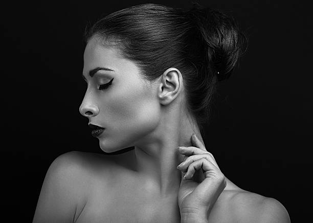 Black and white portrait of beautiful female model posing. Closeup stock photo