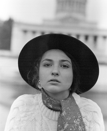 Black and white portrait of  young Caucasian woman in the city