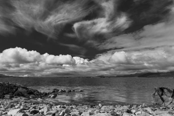 Black and white shot of clouds near the shore near Galway Ireland stock photo
