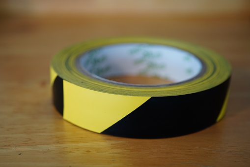 Reel Of Black And Yellow Diagonal Striped Hazard Warning Tape