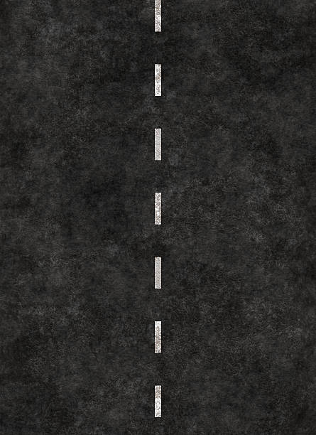 A black background with a white dotted line running through  vertical striped line of a road. highway striping dividing line road marking stock pictures, royalty-free photos & images