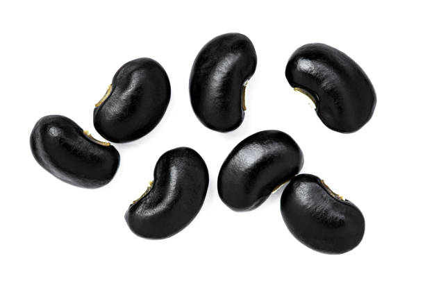 black beans ( Urad dal, black gram, vigna mungo ) isolated on white stock photo