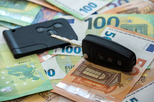 black car key on euro money, insurance or rent car stock photo
