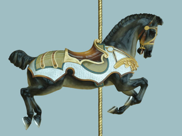 Black Carnival Carousel Horse Childhood Amusement Park Ride A dark black and brown carousel horse ride for children styled with antique retro styled medieval saddle and bridal and armor with gold, green and blue colors and a gold pole, isolated on a blue background. carousel horses stock pictures, royalty-free photos & images