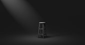 istock Black chair and spotlight low key tone on empty dark room background with alone or darkness concept. 3D rendering. 1317729300