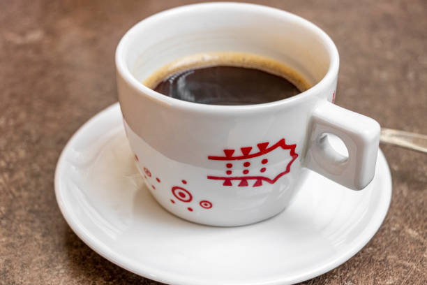 Black coffee in white cup at the Airport Bremen Germany. stock photo
