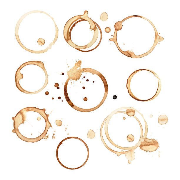 Black coffee rings and stains isolated on white paper Different sized and shaped black coffee rings are isolated on a white background with a clipping path. There are splashes and drops of coffee stains around round rings where the cups sat on the paper. The stains have soaked and smeared in different shapes and sizes. stained stock pictures, royalty-free photos & images