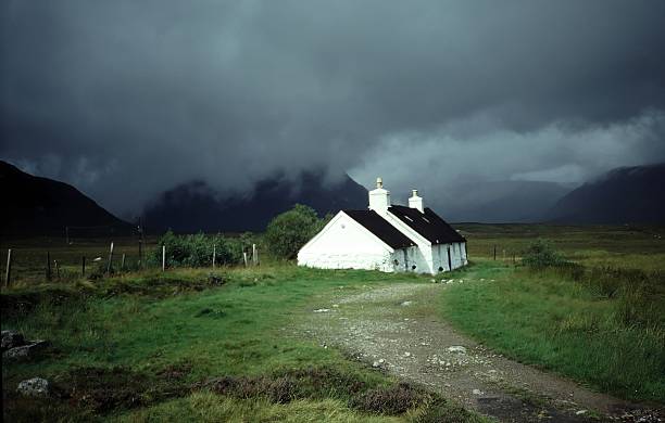 Black Cottage in Glen Coe, Scotland stock photo