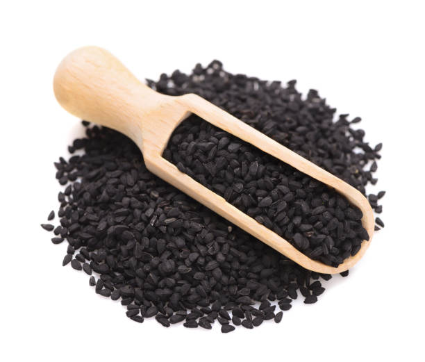 black cumin in a scoop for spices stock photo