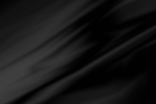 Black fabric background with copy space Black fabric background with copy space silk stock pictures, royalty-free photos & images