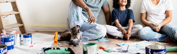 Black family painting house wall people home improvement stock pictures, royalty-free photos & images