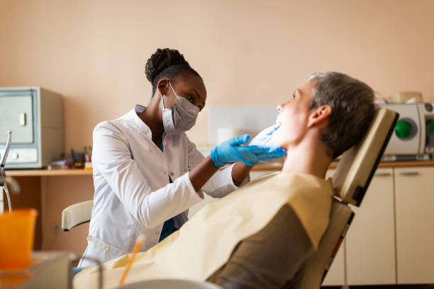 Black female dentist working stock photo