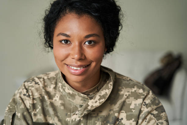 Black female soldier wearing camouflage uniform stock photo
