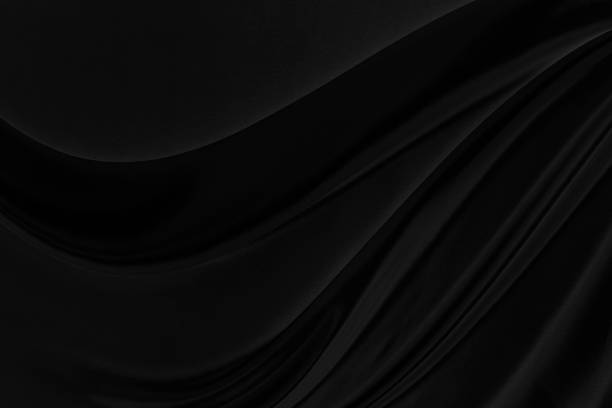 schwarz grau satin dunklen stoff textur luxuriöse glänzend, die abstrakte seide tuch hintergrund mit mustern weiche wellen verwischen schön. - schwarzer hintergrund stock-fotos und bilder