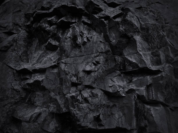 Black grunge background. Black and white background. Mountain texture close-up. Volumetric rock texture. 3D effect. Black stone background for your design. basalt stock pictures, royalty-free photos & images