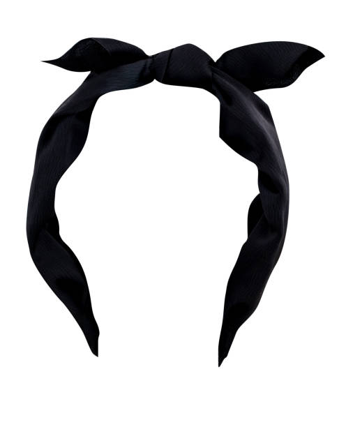 Black hairband with tied bow on top on white background stock photo