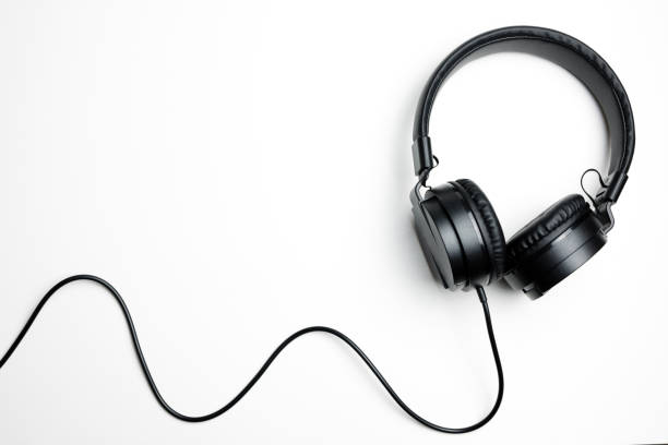Black headphones isolated on the white background stock photo