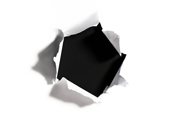 black hole in torn white paper - gat stockfoto's en -beelden
