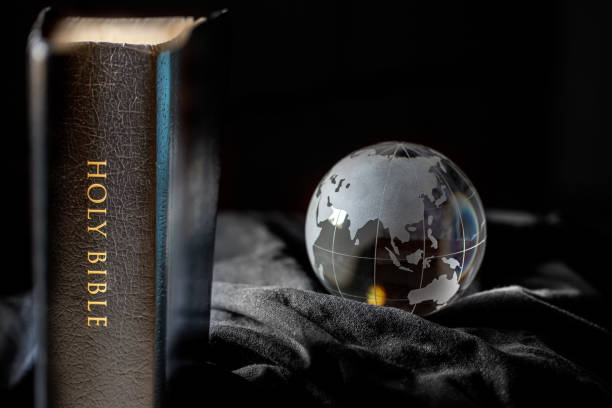 Black Holy Bible with Earth stock photo