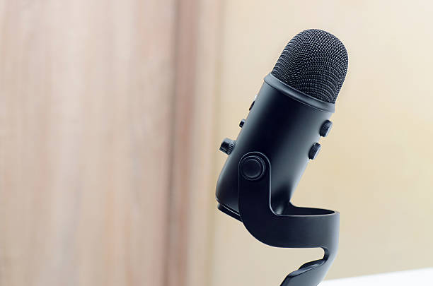 Black Microphone Black Microphone On Wooden Background With Soft Blue Effect usb cable stock pictures, royalty-free photos & images