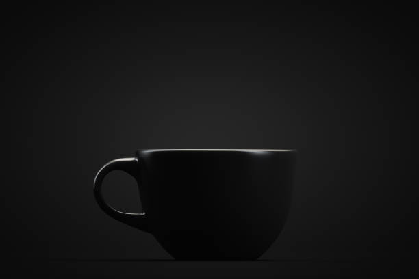 Black mug on a black background. Drinks theme. Design element. stock photo