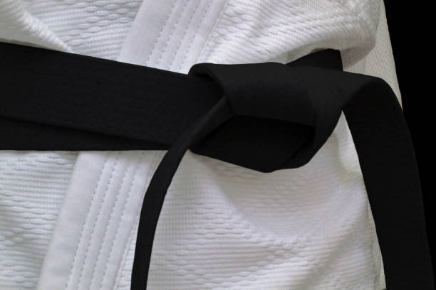 Black obi sash Close-up on a black belt tied around a kimono. bushido lifestyle stock pictures, royalty-free photos & images