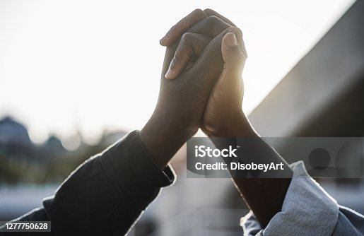 istock Black people holding hands during protest for no racism - Empowerment and equal rights concept 1277750628