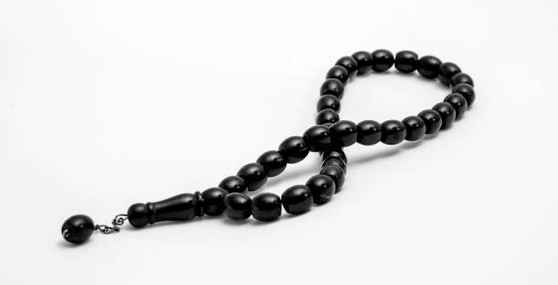 Black prayer beads on a white background stock photo