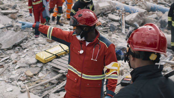 Black rescuer speaking with colleague stock photo
