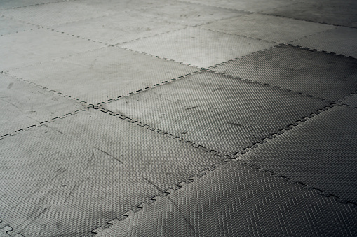 Black Rubber Floor Mat And Tiles Inside A Gym Stock Photo