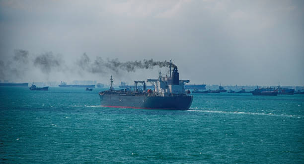 Black Smoke from Ship Sailing on the High Sea stock photo
