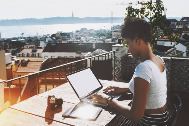 black student girl with laptop on balcony - people portugal imagens e fotografias de stock