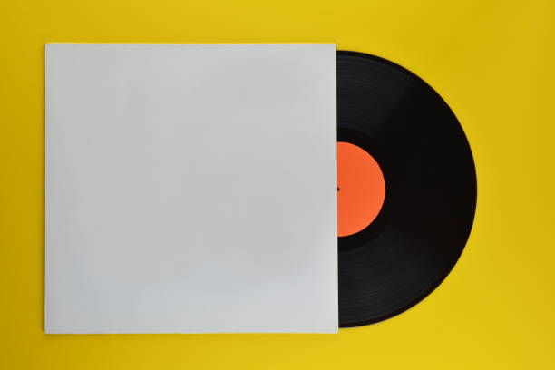 black vinyl record halfway out of white blank cover stock photo