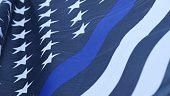 istock Black white american monochrome flag with blue stripe or line, police support. 1369108681