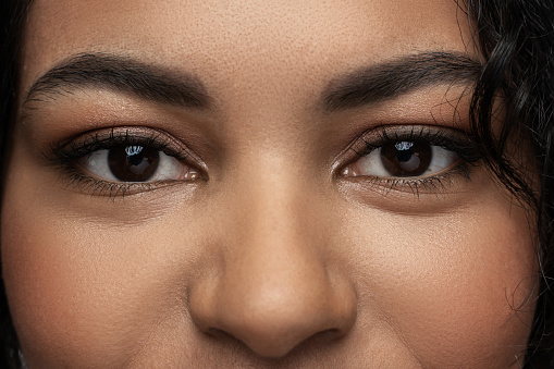 Closeup of black woman face with a beautiful brown eyes