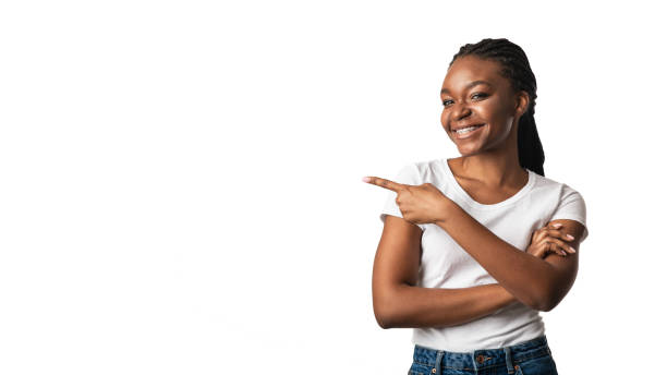 Black Woman In Braces Pointing Finger Aside, White Background, Panorama Black Woman In Braces Pointing Finger Aside At Copy Space Standing Over White Studio Background. Look Here Concept. Panorama human finger stock pictures, royalty-free photos & images