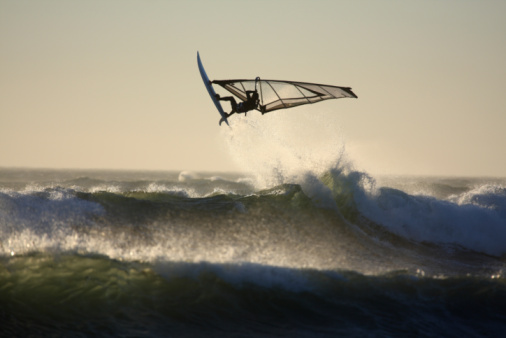 -brand clean- aerial wind surfer on action on blue waters