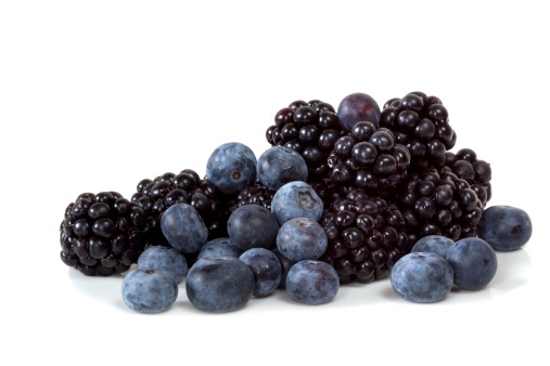 Blackberries and blueberries, isolated on white background.  Fresh berry fruit goodness.  More fruits and vegetables: