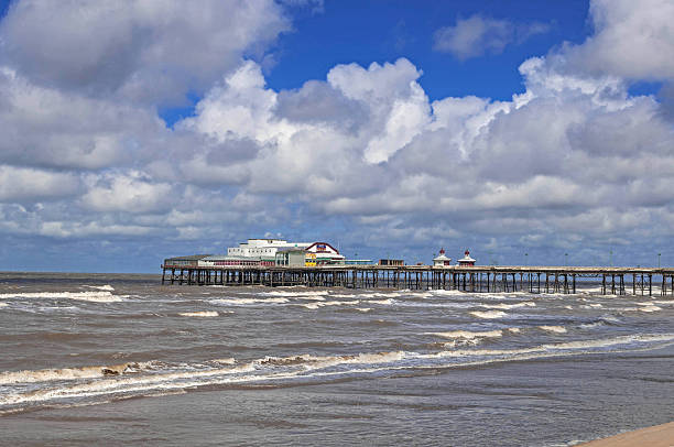 Blackpool North Pier Traditional North Pier in the stormy sea , Seaside town of Blackpool, Lancashire, UK., longest of towns three piers north pier stock pictures, royalty-free photos & images