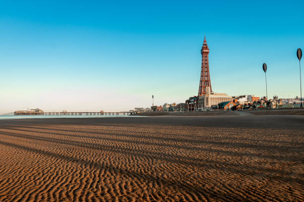 Blackpool seafront Golden mile, Tower, Pier and beach at dawn blackpool tower stock pictures, royalty-free photos & images