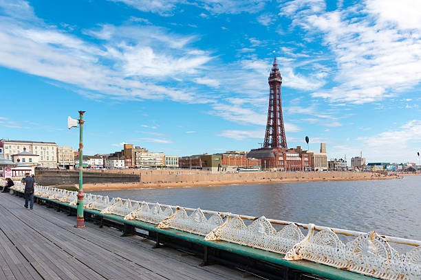 Blackpool Tower Blackpool, United Kingdom - August 6, 2016: Blackpool Tower viewed from North Pier. Sunny weather. blackpool tower stock pictures, royalty-free photos & images