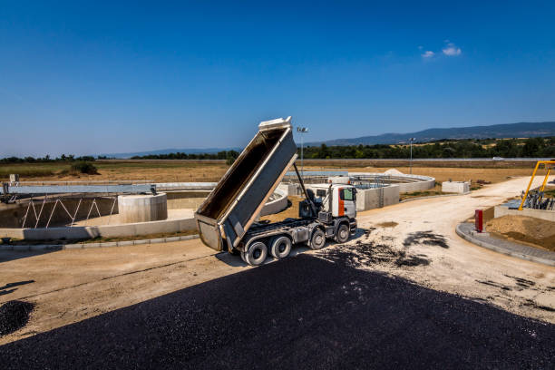 Blacktop Paving Road with Paver and Dump Truck stock photo