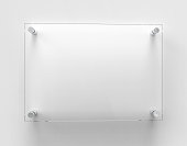 istock Blank A4 transparent glass office corporate Signage plate Mock Up Template, Clear Printing Board For Branding, Logo. Transparent acrylic advertising signboard mockup front view. 3D rendering 1334000438