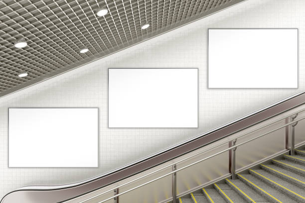 blank advertising poster on underground escalator wall - stairs subway imagens e fotografias de stock