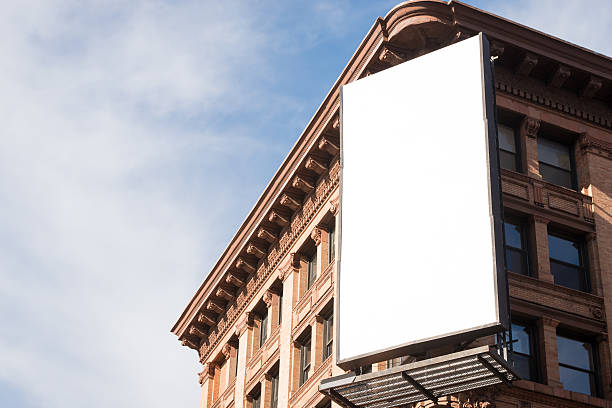 Blank Billboard A blank billboard in Soho New York. billboard posting stock pictures, royalty-free photos & images