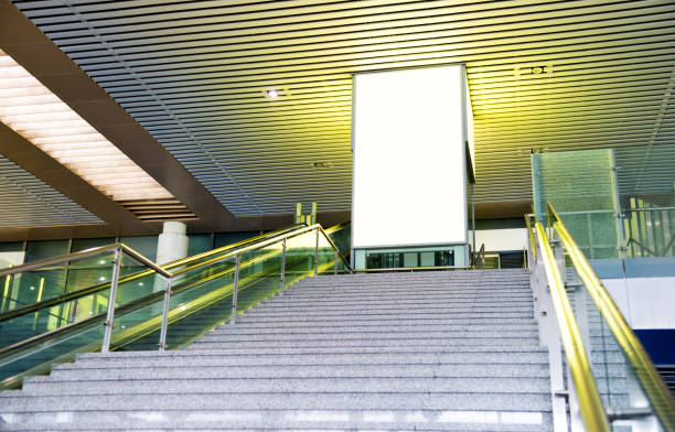 blank billboard standing on stairway entrance - stairs subway imagens e fotografias de stock