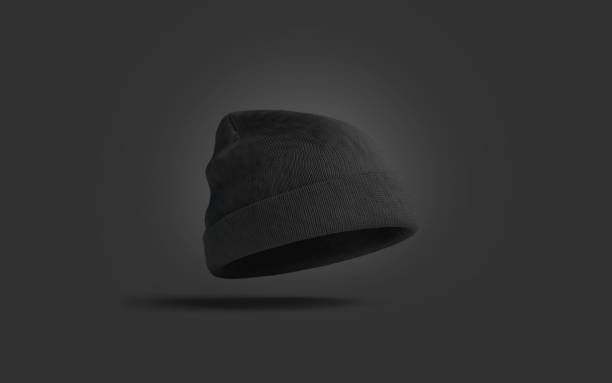 Blank black knitted beanie mockup on dark background Blank black knitted beanie mockup on dark background, 3d rendering. Empty soft garment mock up. Clear wool headwear for fan or sport template. knit hat stock pictures, royalty-free photos & images